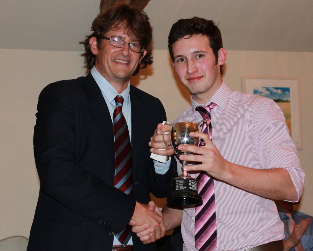 Peter Lambert receives Premier XI player of the year from captain Mark Thomas